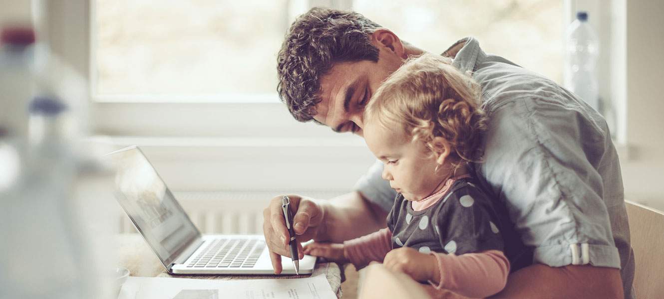 Father and daughter on computer