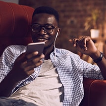 Young man listening to music on phone