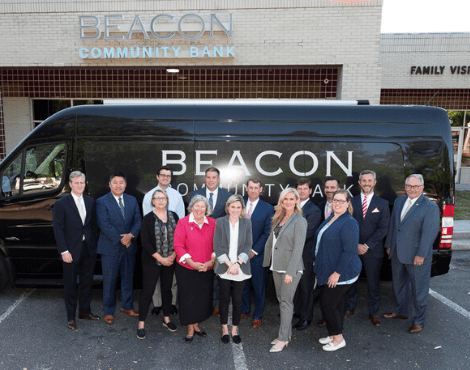 employees in front of Beacon van